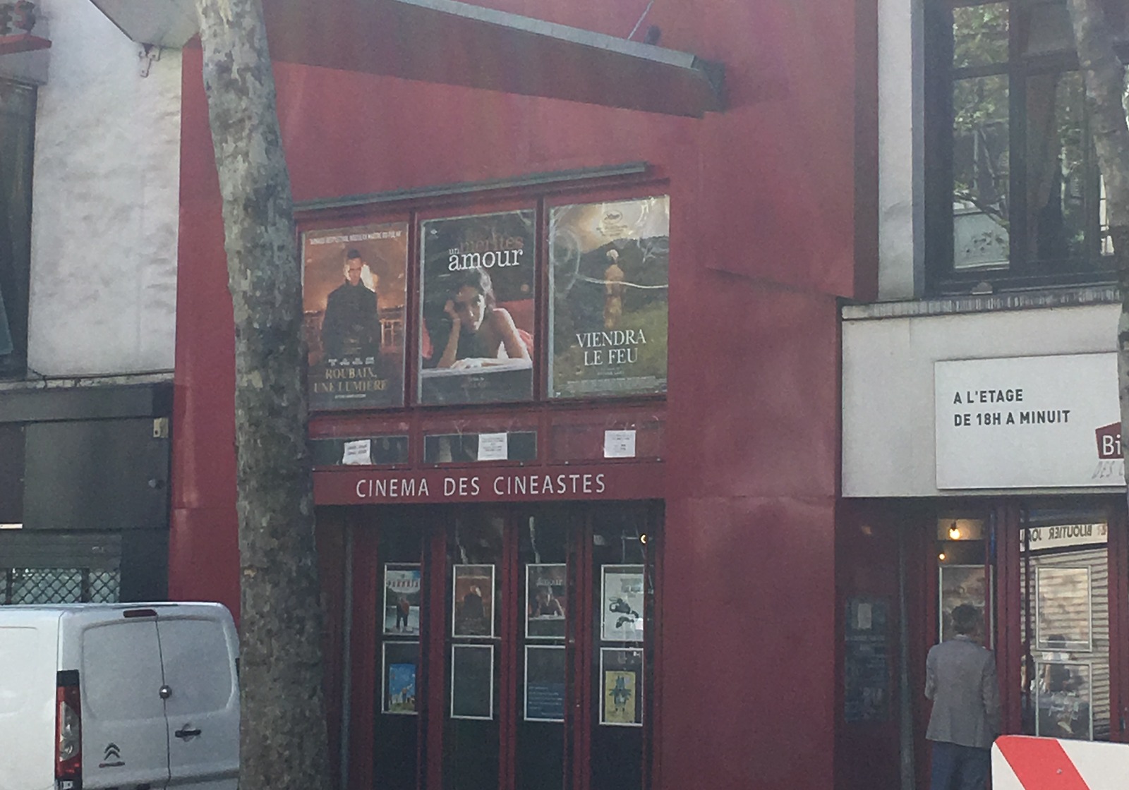The red façade and entrance of Cinéma des Cinéastes on avenue de Clichy in Paris.